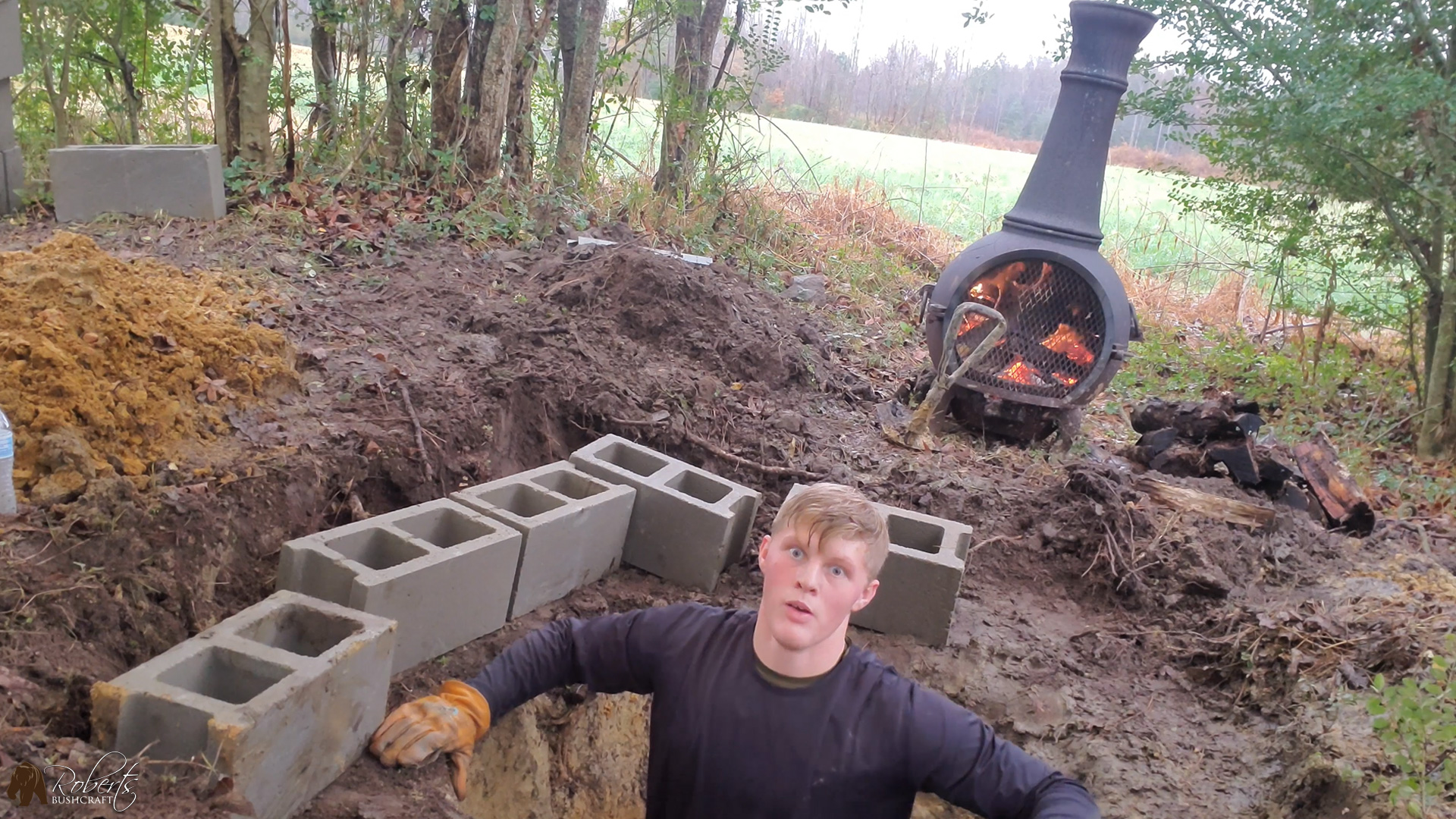 Digging an outhouse hole in the rain is no fun