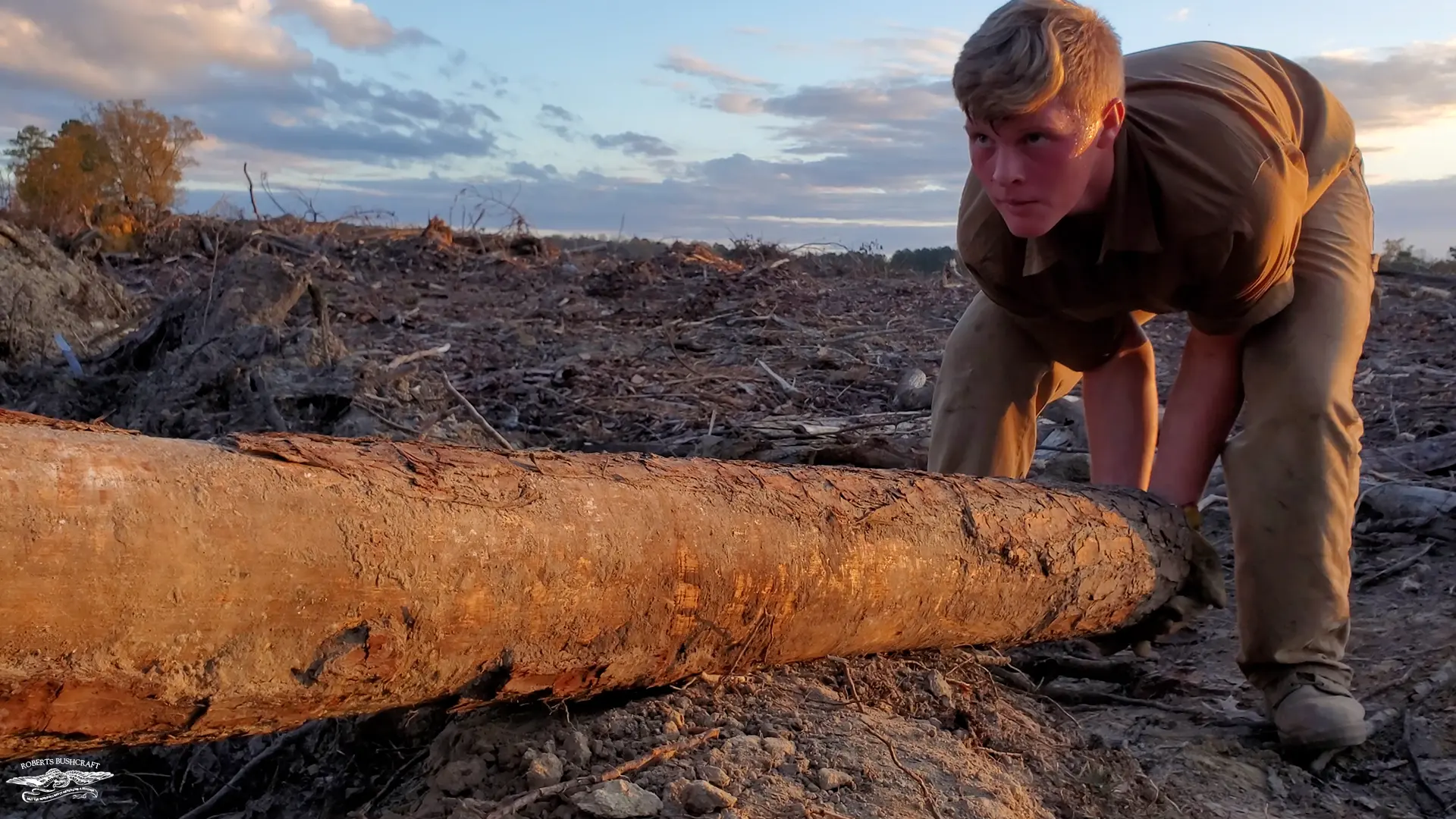 Gabriel lifts the last log of the day