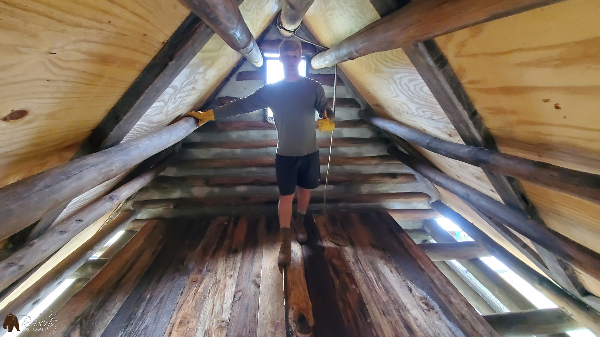Standing on custom cut pine lumber in the loft of the cabin