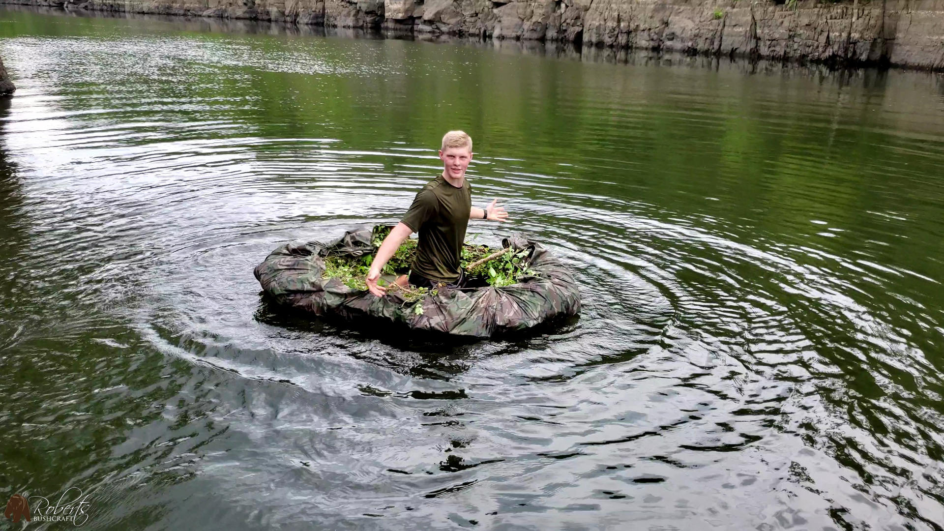 paddling survival raft across the river